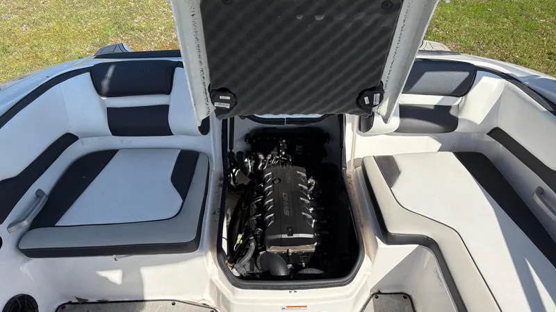 Slide: The Image of 2024 Yamaha AR195 boat engine compartment, showcasing powerful motor components. - 31