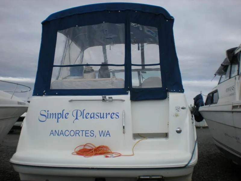 Slide: The Image of 2006 Bayliner 245 SB boat named "Simple Pleasures" docked in Anacortes, WA. - 5