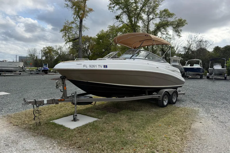 Slide: The Image of 2008 Yamaha Boats 232 Limited on trailer, parked outdoors under cloudy sky. - 10