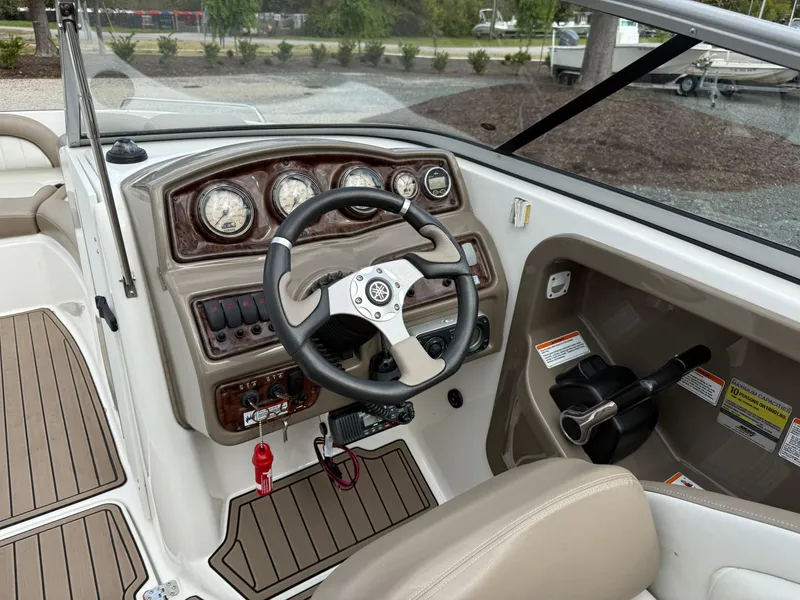 Slide: The Image of 2008 Yamaha Boats 232 Limited dashboard with steering wheel and controls. - 5