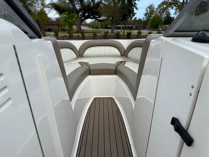 Slide: The Image of 2008 Yamaha Boats 232 Limited interior with cushioned seating and sleek design. - 7