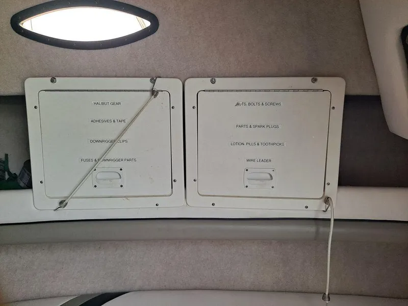 Slide: The Image of Interior view of a 2000 Seaswirl 2501 boat with labeled storage compartments. - 11
