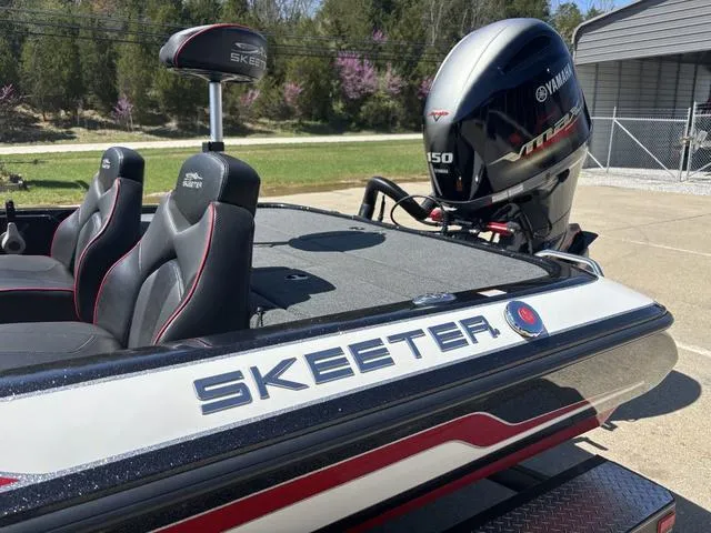 Slide: The Image of 2022 Skeeter ZX150 boat with Yamaha engine, featuring sleek design and comfortable seating. - 12