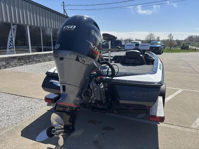 Slide: The Image of 2022 Skeeter ZX150 boat with Yamaha engine, parked outdoors on a sunny day. - 2