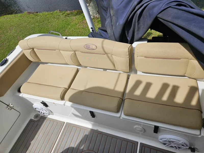 Slide: The Image of Beige seating on 2018 Sea Hunt Ultra 235 SE boat, near water. - 6