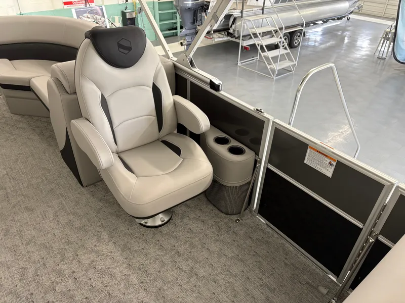 Slide: The Image of Luxurious seating on 2025 South Bay 222RS pontoon boat with cup holders and modern design. - 7