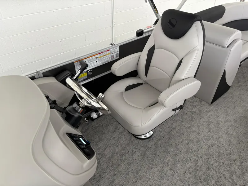 Slide: The Image of Captain's seat of 2025 South Bay 222RS pontoon boat, featuring modern design and controls. - 8
