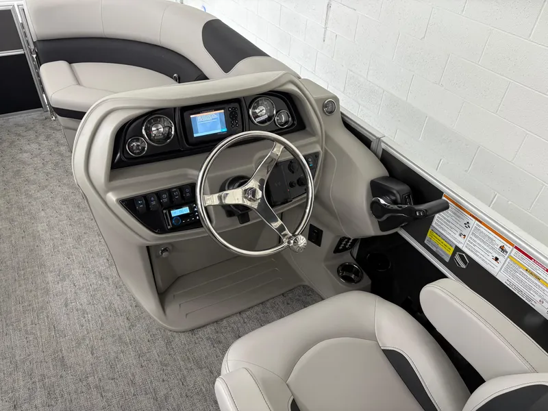 Slide: The Image of 2025 South Bay 222RS boat interior with modern steering console and seating. - 9