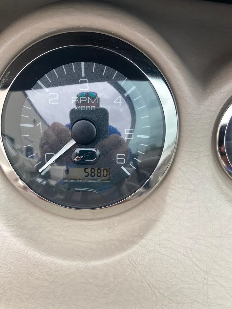 Slide: The Image of Close-up of a 2003 Sea Ray 200 Bow Rider RPM gauge showing 5880 RPM. - 14