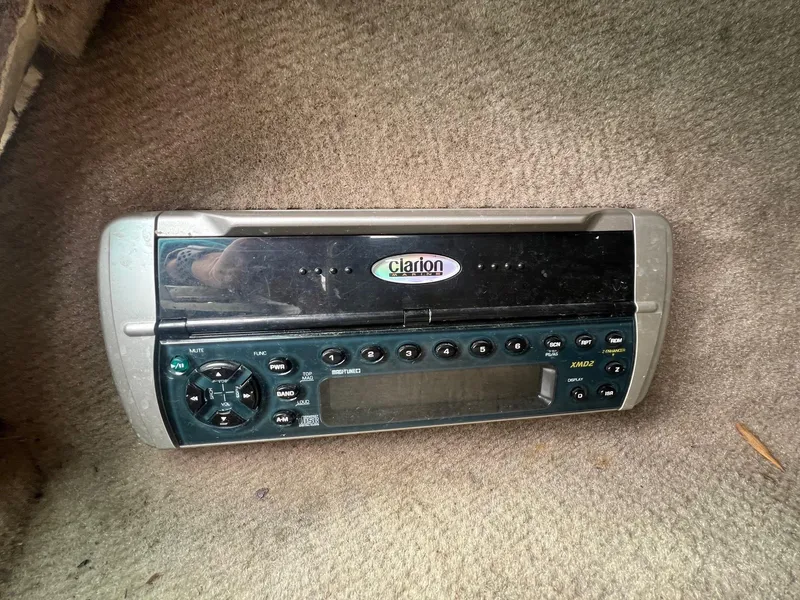 Slide: The Image of Clarion stereo system in a 2003 Sea Ray 200 Bow Rider boat. - 16