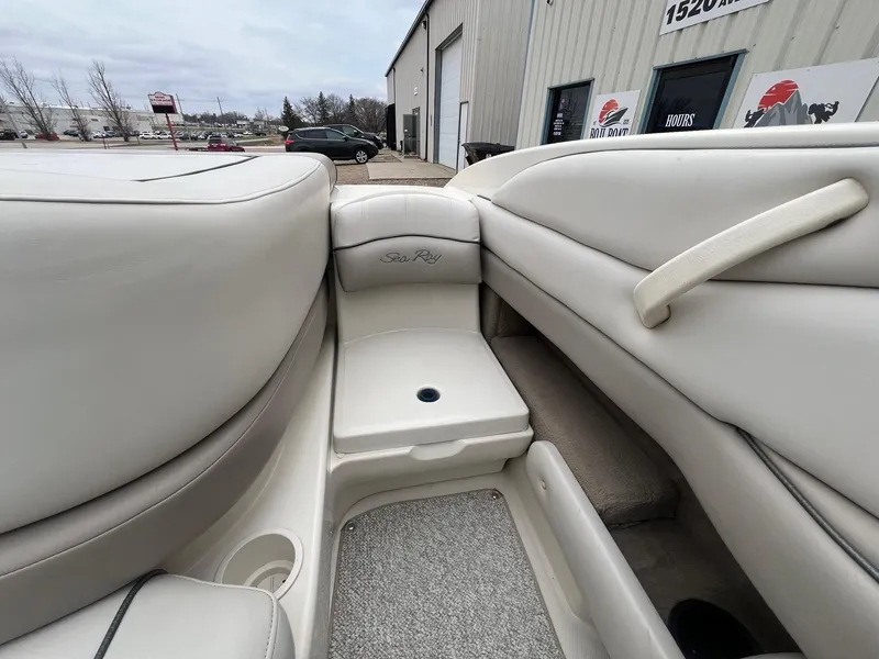 Slide: The Image of Interior of a 2003 Sea Ray 200 Bow Rider boat with white seating. - 20