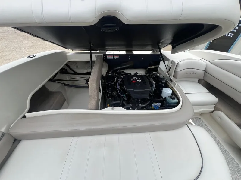 Slide: The Image of 2003 Sea Ray 200 Bow Rider engine compartment with open hatch, showcasing interior details. - 23