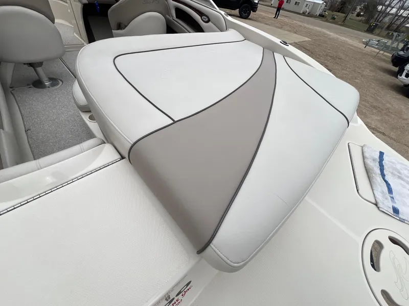 Slide: The Image of 2003 Sea Ray 200 Bow Rider boat interior with cushioned seating and modern design. - 26