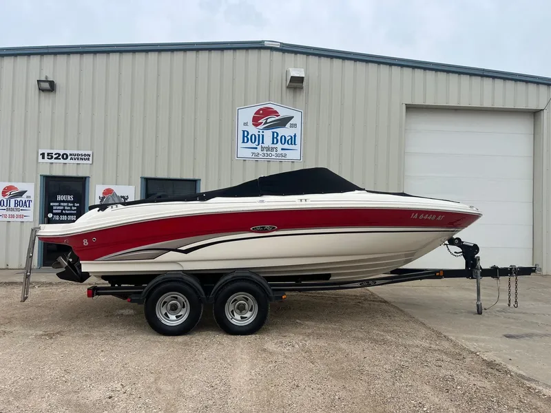 Slide: The Image of 2003 Sea Ray 200 Bow Rider boat on trailer outside Boji Boat building. - 31