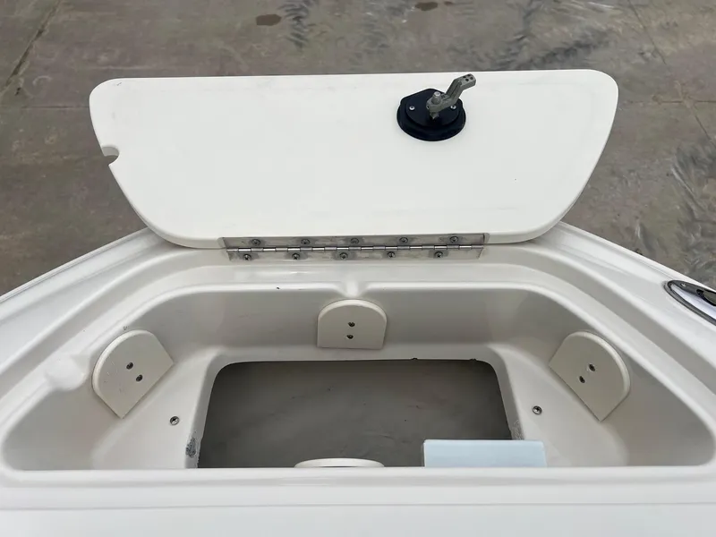 Slide: The Image of Open storage compartment on a 2003 Sea Ray 200 Bow Rider boat. - 9