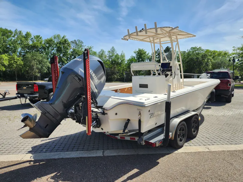 Slide: The Image of 2018 Pathfinder 2500 Hybrid boat on trailer, parked outdoors. - 10