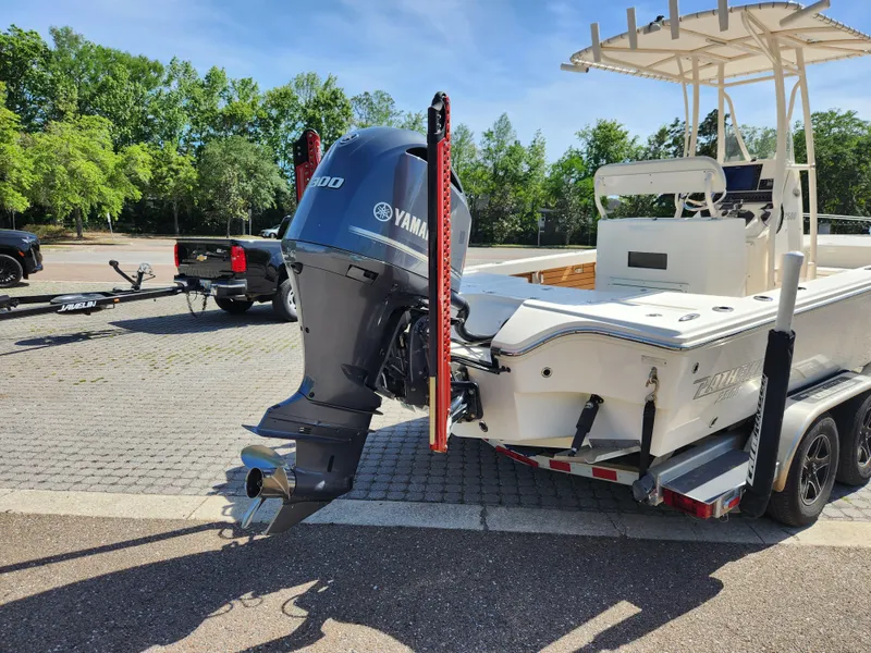 Slide: The Image of 2018 Pathfinder 2500 Hybrid boat with Yamaha engine on trailer in sunny parking lot. - 14
