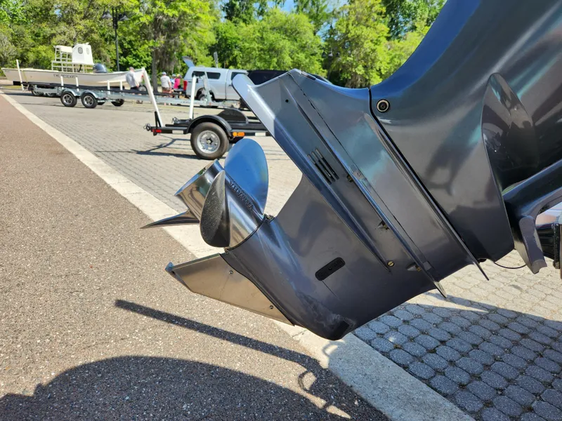 Slide: The Image of Outboard motor of a 2018 Pathfinder 2500 Hybrid boat at a dockside. - 23