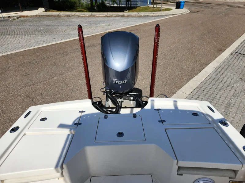 Slide: The Image of 2018 Pathfinder 2500 Hybrid boat with 300 horsepower engine, docked on a sunny day. - 27