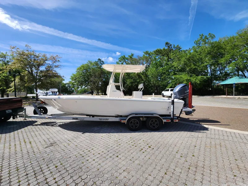 Slide: The Image of 2018 Pathfinder 2500 Hybrid boat on trailer in sunny outdoor setting. - 3