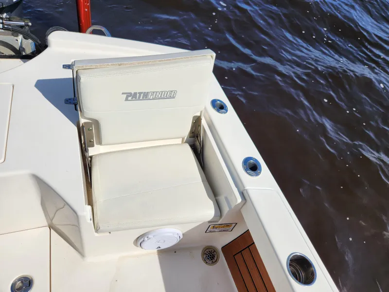 Slide: The Image of Pathfinder 2500 Hybrid 2018 boat seat on deck, near water. - 30