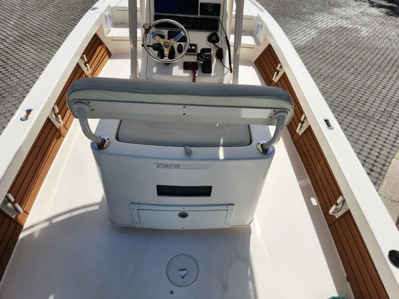 Slide: The Image of 2018 Pathfinder 2500 Hybrid boat interior with steering console and seating. - 32