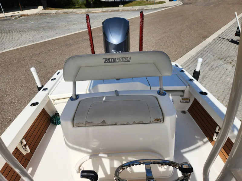 Slide: The Image of 2018 Pathfinder 2500 Hybrid boat interior with steering wheel and seating. - 38