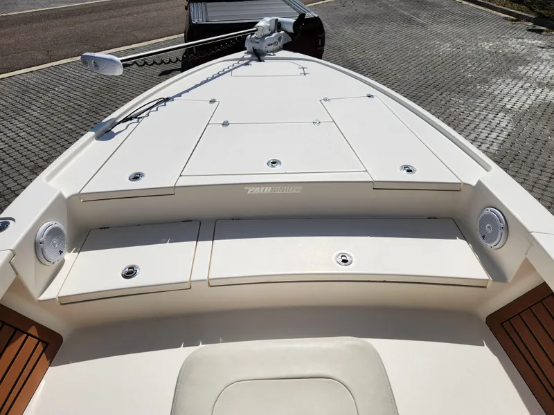 Slide: The Image of 2018 Pathfinder 2500 Hybrid boat deck with storage compartments and trolling motor. - 47