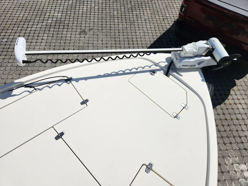 Slide: The Image of 2018 Pathfinder 2500 Hybrid boat with trolling motor on deck. - 48