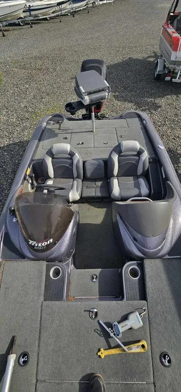 Slide: The Image of 2003 Triton TR-20 boat with dual seats and steering console. - 6