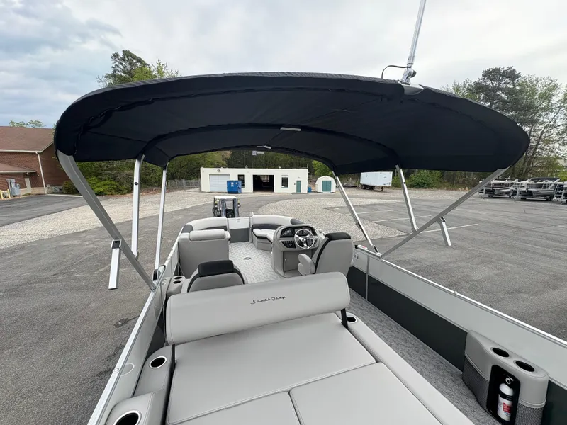 Slide: The Image of 2025 South Bay 224UL pontoon boat with canopy, spacious seating, and modern design. - 17