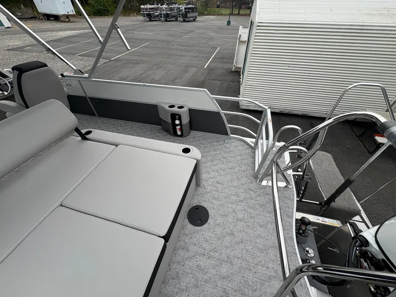 Slide: The Image of 2025 South Bay 224UL pontoon boat with gray seating and carpeted deck. - 18