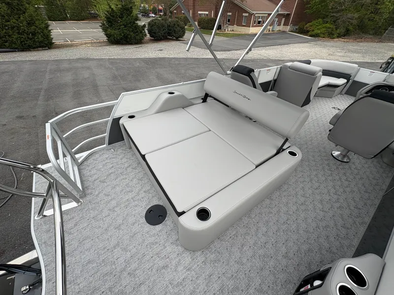 Slide: The Image of 2025 South Bay 224UL pontoon boat with gray seating and spacious deck layout. - 19