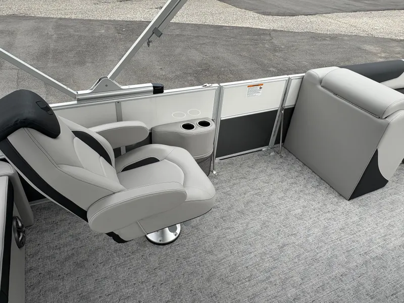 Slide: The Image of 2025 South Bay 224UL boat interior with gray seating and cup holders. - 21