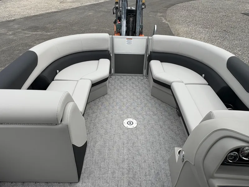 Slide: The Image of 2025 South Bay 224UL pontoon boat interior with gray seating and carpet. - 23