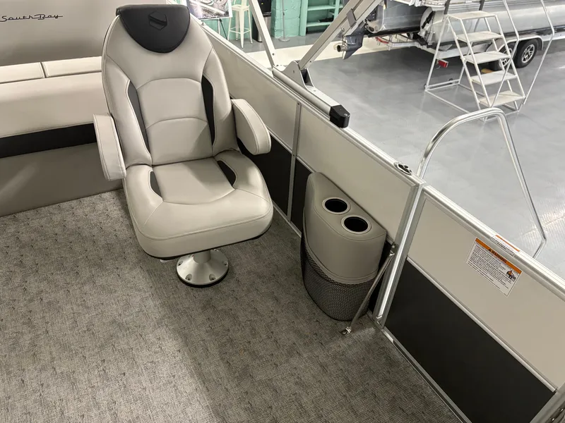 Slide: The Image of Luxurious interior of 2025 South Bay 224UL boat with plush seating and cup holders. - 26