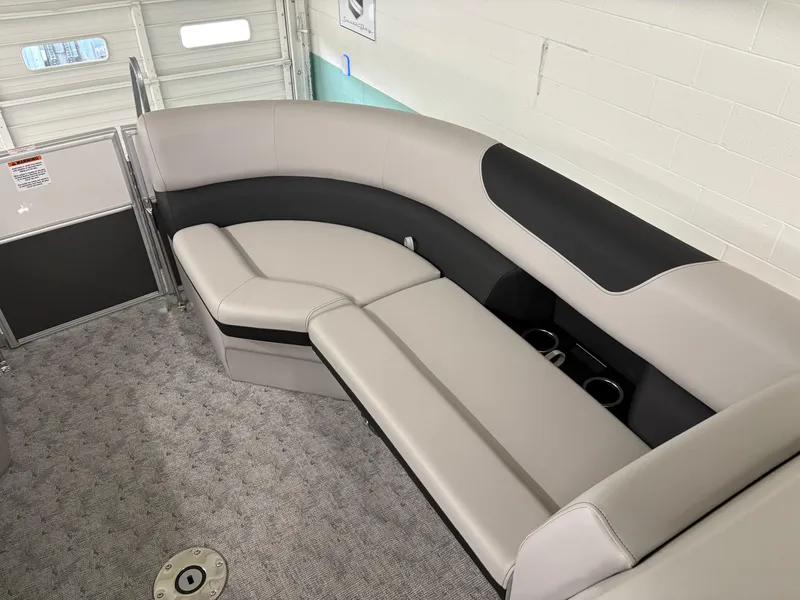 Slide: The Image of Luxurious seating in 2025 South Bay 224UL pontoon boat, featuring plush upholstery and cup holders. - 27