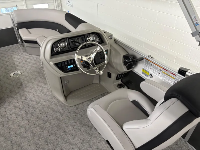 Slide: The Image of 2025 South Bay 224UL boat interior with modern helm and seating. - 28