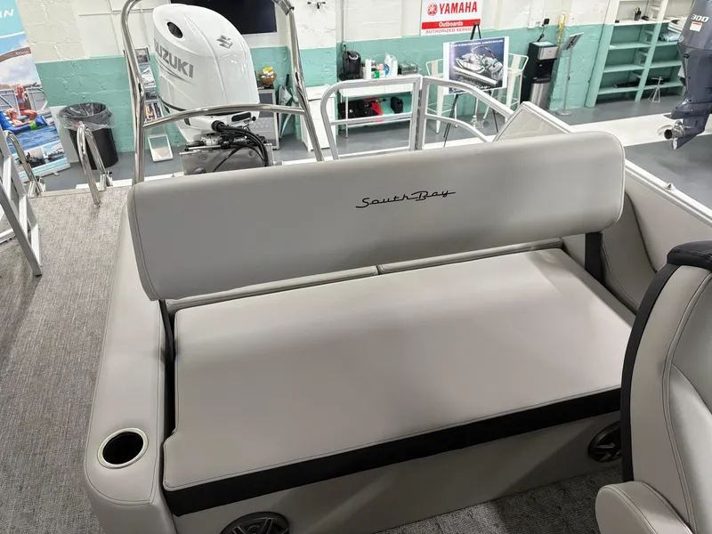 Slide: The Image of 2025 South Bay 224UL boat interior with Suzuki engine, featuring comfortable seating. - 29