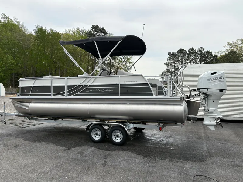 Slide: The Image of 2025 South Bay 224UL pontoon boat with Suzuki outboard motor on a trailer. - 5