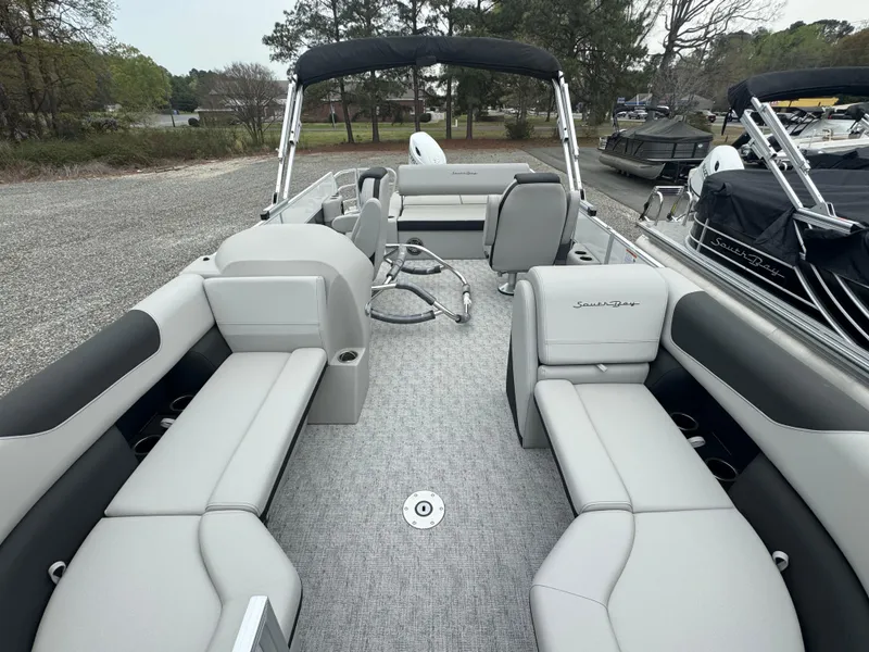 Slide: The Image of 2025 South Bay 224UL pontoon boat with spacious seating and modern design. - 9
