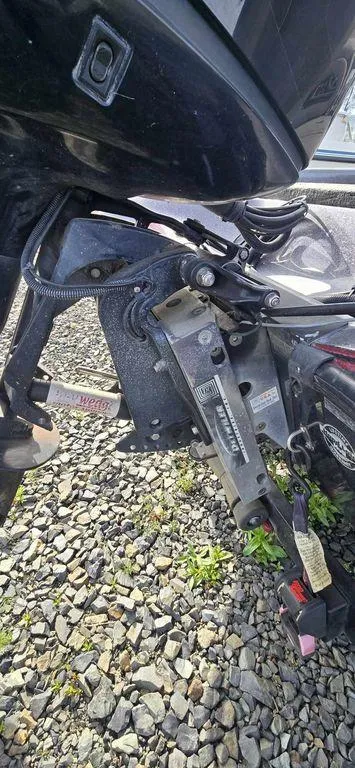 Slide: The Image of Close-up of a 2002 Arima Sea Ranger 19 boat motor on gravel. - 8