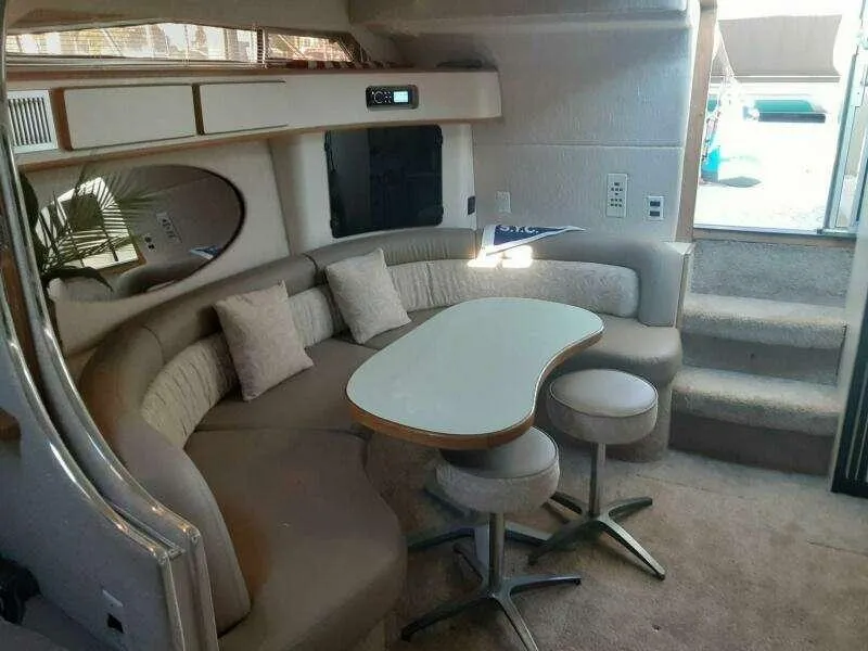 Slide: The Image of Interior of 1993 Sea Ray 400 Sundancer yacht with cozy seating and decor. - 3