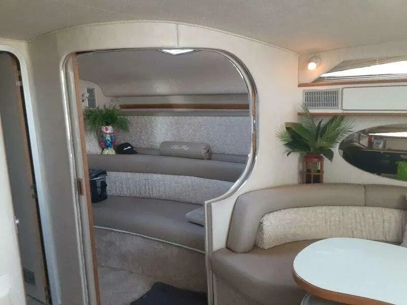 Slide: The Image of Interior of 1993 Sea Ray 400 Sundancer yacht with kitchenette and storage cabinets. - 6