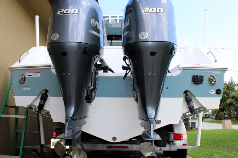 Slide: The Image of 2022 Sea Hunt Gamefish 27 with Coffin Box, featuring dual 200 horsepower engines. - 13