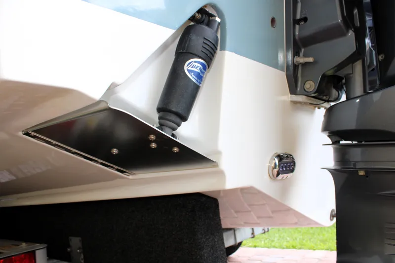 Slide: The Image of 2022 Sea Hunt Gamefish 27 boat stern detail with trim tab and motor. - 16