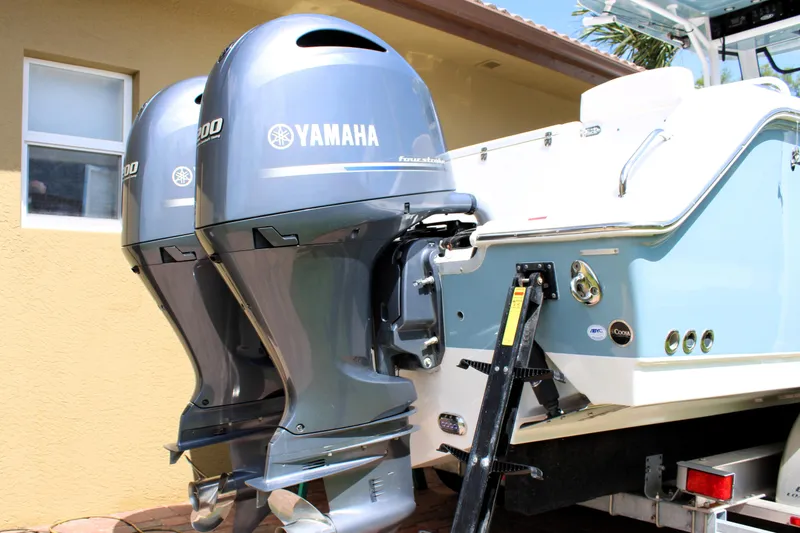 Slide: The Image of Twin Yamaha outboard engines on a 2022 Sea Hunt Gamefish 27 with Coffin Box. - 17