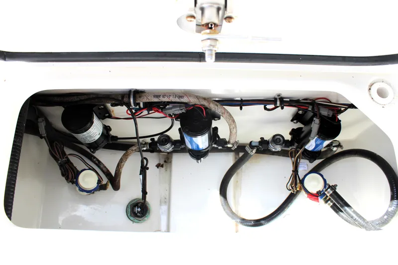 Slide: The Image of 2022 Sea Hunt Gamefish 27 boat interior wiring and plumbing components. - 18