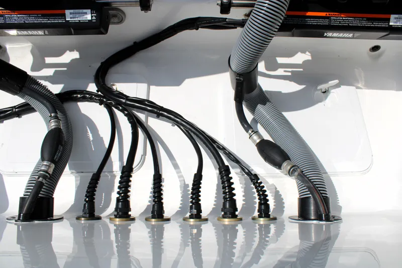 Slide: The Image of Wiring and hoses in a 2022 Sea Hunt Gamefish 27 boat. - 19