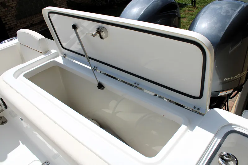 Slide: The Image of 2022 Sea Hunt Gamefish 27 with Coffin Box, open storage compartment, dual outboard motors. - 22